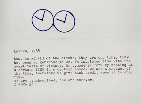 A typewritten note titled Lovers, 1988, with two clock faces drawn above it